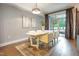 Modern dining room with stylish decor, a large window, and hardwood floors at 618 N Boylan Ave # 520, Raleigh, NC 27603