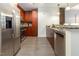 Modern kitchen with stainless steel appliances, dark wood cabinets, and hardwood flooring at 618 N Boylan Ave # 520, Raleigh, NC 27603