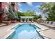 Relaxing community swimming pool surrounded by mature trees and lounge chairs for resident enjoyment at 618 N Boylan Ave # 520, Raleigh, NC 27603