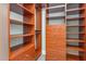 Spacious walk-in closet features custom shelving, wooden drawers and hanging space at 618 N Boylan Ave # 520, Raleigh, NC 27603