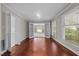 Elegant dining room featuring hardwood floors and large windows at 6605 Huntingridge Rd, Chapel Hill, NC 27517