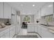 Bright kitchen with ample cabinetry and counter space, flowing into a cozy dining area at 6605 Huntingridge Rd, Chapel Hill, NC 27517