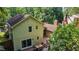 Aerial view of a home with a large deck and well-maintained landscaping, showcasing the property's backyard at 6701 Winding Trail Trl, Raleigh, NC 27612