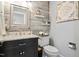 Stylish half bathroom featuring wood paneling, updated vanity, and modern fixtures at 7016 Valley Dr, Raleigh, NC 27612