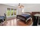 Comfortable bedroom featuring a bed, and natural light from a large window at 7016 Valley Dr, Raleigh, NC 27612