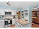 Well-equipped kitchen with ample counter space, modern appliances, and eat-in island at 7016 Valley Dr, Raleigh, NC 27612