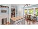 Stylish kitchen with an island, bay window breakfast area, and modern appliances at 7016 Valley Dr, Raleigh, NC 27612