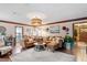 Cozy living room showcasing a large sectional sofa, and layered rug over hardwood floors at 7016 Valley Dr, Raleigh, NC 27612