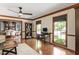Spacious office area with beautiful natural light, custom desk, and stylish furnishings at 7016 Valley Dr, Raleigh, NC 27612