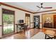 Bright home office featuring large windows, built-in desk, and a cozy reading nook at 7016 Valley Dr, Raleigh, NC 27612