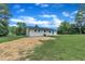 Large backyard with fresh seeding around the perimeter of the house at 802 Creech Church Rd, Kenly, NC 27542
