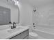This is a stylish bathroom with a vanity and combination tub and shower at 802 Creech Church Rd, Kenly, NC 27542