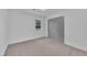 A bedroom with carpeting, a closet, and a window at 802 Creech Church Rd, Kenly, NC 27542