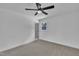 Bright bedroom is carpeted and includes a ceiling fan at 802 Creech Church Rd, Kenly, NC 27542