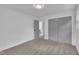This bedroom has neutral paint, large closet and ceiling light at 802 Creech Church Rd, Kenly, NC 27542