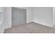 This bedroom features neutral carpet and large closet with painted bi-fold doors at 802 Creech Church Rd, Kenly, NC 27542
