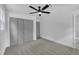 Neutral bedroom with carpet flooring, closet, ceiling fan and an ensuite bathroom at 802 Creech Church Rd, Kenly, NC 27542