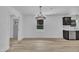 A dining room with an adjacent kitchen with wood flooring at 802 Creech Church Rd, Kenly, NC 27542