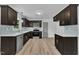 Spacious kitchen features stainless steel appliances, light countertops, and modern dark cabinets at 802 Creech Church Rd, Kenly, NC 27542