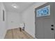 This is a small laundry room with a sink and door with decorated window at 802 Creech Church Rd, Kenly, NC 27542