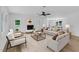 Bright living room features hardwood floors, fireplace, and neutral decor at 802 Creech Church Rd, Kenly, NC 27542