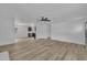 A spacious living room with wood floors and views to the kitchen at 802 Creech Church Rd, Kenly, NC 27542