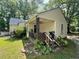Charming front porch with a garden, vinyl siding, on a one story home at 981 Leasburg Rd, Roxboro, NC 27573