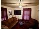 A simple living room with dark accents, ceiling fan, and comfortable furniture at 981 Leasburg Rd, Roxboro, NC 27573