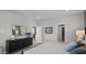 Comfortable bedroom featuring a large dresser, a mirror and neutral decor at 1101 Shovelhead Dr # 51, Durham, NC 27703