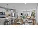 Open concept kitchen and dining area with modern white cabinetry and stainless steel appliances at 1101 Shovelhead Dr # 51, Durham, NC 27703