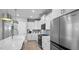 Well-equipped kitchen featuring stainless steel refrigerator and modern appliances at 1101 Shovelhead Dr # 51, Durham, NC 27703