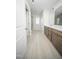 Well-lit bathroom featuring double vanity, tile flooring, and glass shower at 1108 Matterhorn Dr, Fuquay Varina, NC 27526