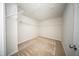 Spacious walk-in closet featuring installed shelving and carpeted floor at 1108 Matterhorn Dr, Fuquay Varina, NC 27526