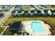 Aerial view of a sparkling community pool with lounge chairs and umbrellas at 1108 Matterhorn Dr, Fuquay Varina, NC 27526