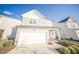Charming two-story home boasts a spacious two-car garage and manicured landscaping at 1108 Matterhorn Dr, Fuquay Varina, NC 27526