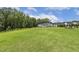 Well-maintained backyard showing a lush green lawn and partial fencing at 114 Forest Meadow Ct, Garner, NC 27529