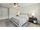 Neutral main bedroom featuring matching lamps and a decorative accent rug at 114 Forest Meadow Ct, Garner, NC 27529