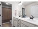 Bathroom featuring a double vanity, tiled floors, and a shower with a fabric curtain in a separate room at 1154 Yorkshire Dr, Burlington, NC 27215