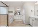 Well-lit bathroom with dual vanities, soaking tub, and modern fixtures at 1154 Yorkshire Dr, Burlington, NC 27215