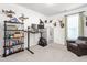 Spacious bedroom featuring desk, storage, gun safe, mounted animals and window at 1154 Yorkshire Dr, Burlington, NC 27215