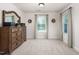 Well-lit bedroom featuring a wooden dresser and a window with natural light at 1154 Yorkshire Dr, Burlington, NC 27215