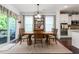 Dining area with a wooden table, chairs, decor, and natural lighting at 1154 Yorkshire Dr, Burlington, NC 27215
