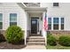 Inviting front entrance featuring a classic door, stone steps, and charming landscaping at 1154 Yorkshire Dr, Burlington, NC 27215