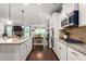 Open concept kitchen with granite countertops, stainless appliances, and dining area at 1154 Yorkshire Dr, Burlington, NC 27215