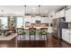 Modern kitchen featuring stainless appliances, granite countertops, and eat-in island at 1154 Yorkshire Dr, Burlington, NC 27215
