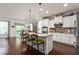 Bright kitchen featuring granite countertops, eat-in island, and pendant lighting at 1154 Yorkshire Dr, Burlington, NC 27215