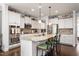 Gourmet kitchen featuring granite countertops, stainless steel appliances, and an island with seating at 1154 Yorkshire Dr, Burlington, NC 27215