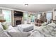 Open-concept living room boasts a fireplace, dining area, and comfortable seating at 1154 Yorkshire Dr, Burlington, NC 27215