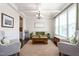 Open living room featuring a coffered ceiling, hardwood floors, and a cozy seating area at 1154 Yorkshire Dr, Burlington, NC 27215