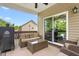 Outdoor porch with a seating area, ceiling fan, view to the back yard, and a grill for outdoor cooking at 1154 Yorkshire Dr, Burlington, NC 27215